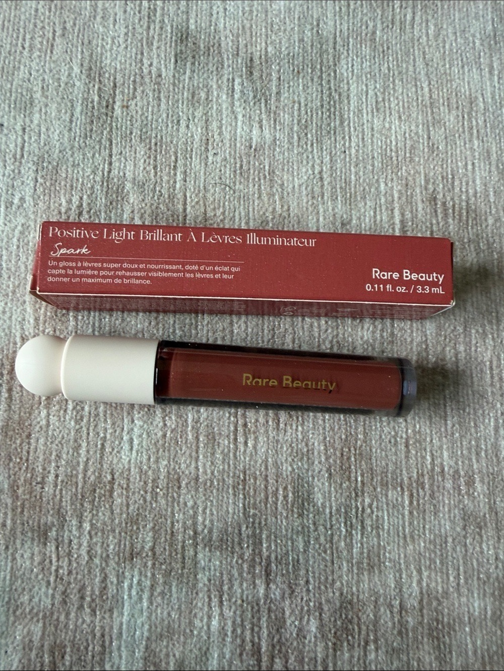 Rare Beauty Lip Gloss Warm Brick Red Spark